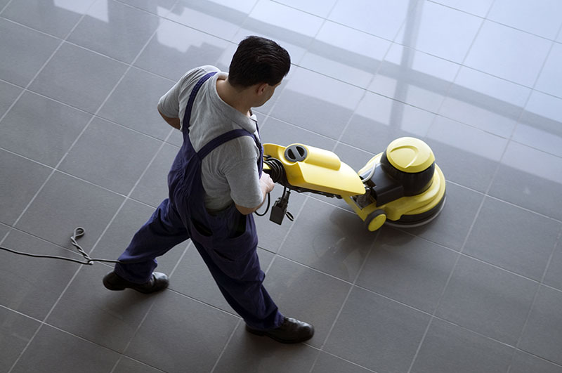 Janitor cleaning floor
